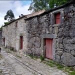 stone-buildings-red-door